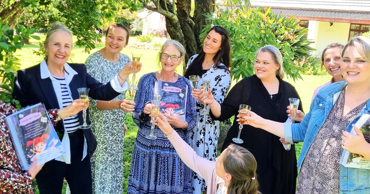 Teachers celebrating at a Yellow Tree reading workshop