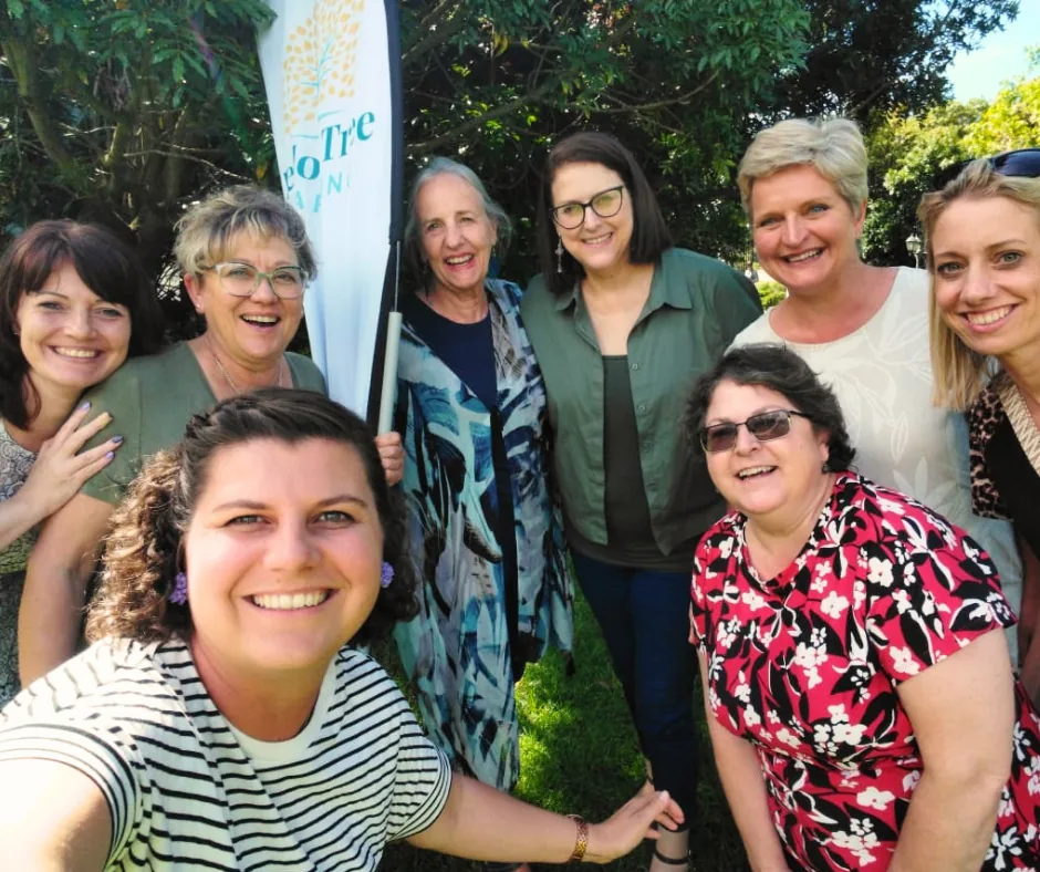 Yellow Tree Reading community of educators smiling together outdoors